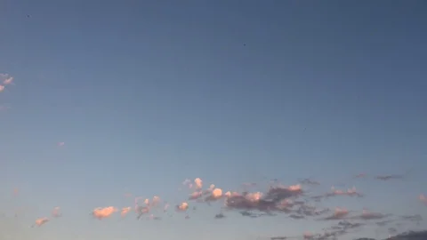 White clouds disappear in the hot sun on blue sky.Time-lapse motion clouds blue Stock Footage