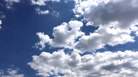 White clouds disappear in the hot sun on blue sky. Time-lapse motion clouds blue Stock Footage 78496418