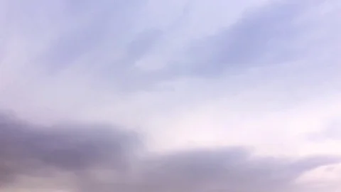 White clouds disappear in the hot sun on blue sky. Time-lapse motion clouds blue Stock Footage