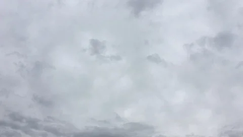 White clouds disappear in the hot sun on blue sky. Time-lapse motion clouds blue Stock Footage 85668085