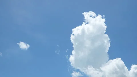 White Clouds Dissolving in Clear Blue Sky Timelapse Stock Footage 337419557