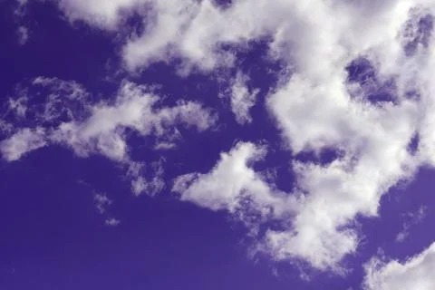 White clouds on a dramatic dark sky, cloudscape copy space for text Stock Photos