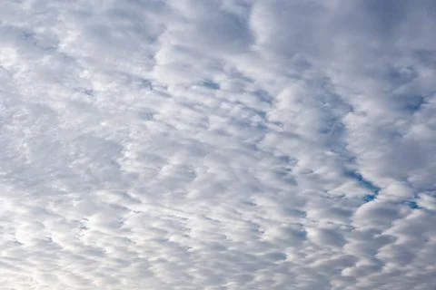 White clouds in the Dramatic morning Blue sky. Cloudscape Nature weather clou Stock Photos