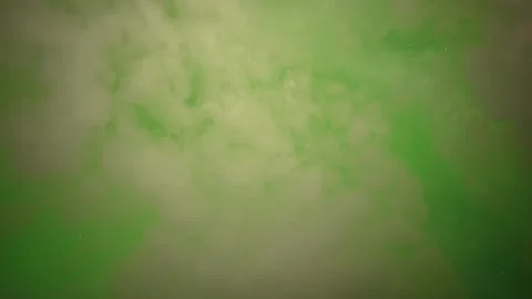 White clouds drift in front of a stary night sky that is filled with bright Stock Footage 339733502