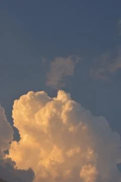 White clouds drifting in open blue sky 库存照片