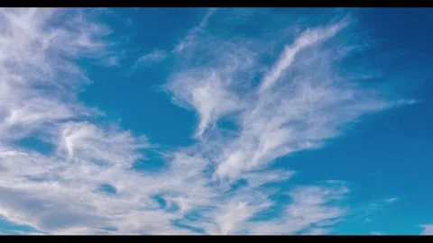 White clouds float across the blue sky. Timelapse 스톡 동영상 147525331