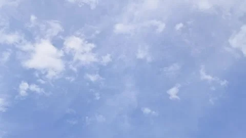 White clouds float across the blue sky. Puffy fluffy soft clouds Stock Footage 311389996