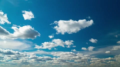 White clouds float across the blue sky, timelapse Stock Footage 333960157