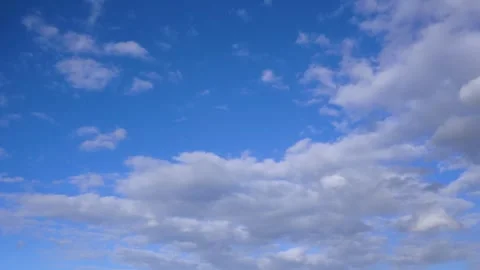 White clouds float across the blue sky. Timelapse Stock-Footage 335302949