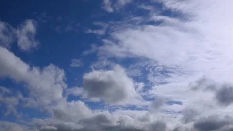 White clouds float across the blue sky. Timelapse Stock-Footage 335303005