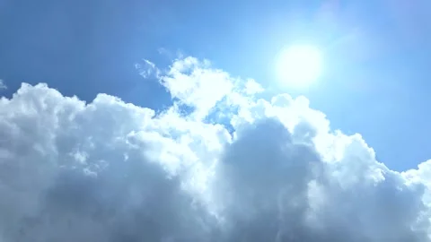 White clouds float across the blue sky. Puffy fluffy soft clouds. Timelapse Stock Footage 338277685