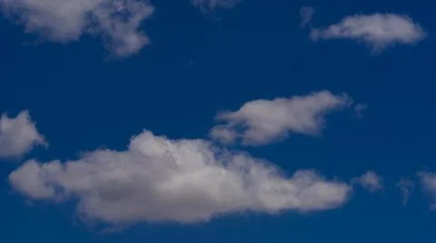 White clouds float across the blue sky Stock-Fotos