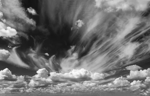 White clouds float across the blue sky Stock Photos