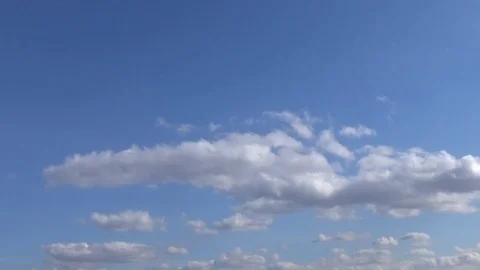 White clouds float on the blue sky Stock Footage 75555879