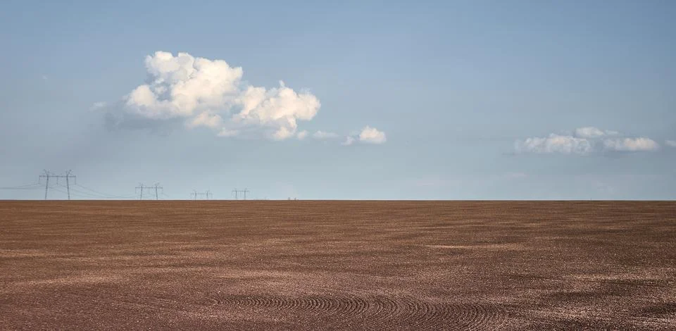 White clouds float over a field at a Ukrainian farm Stock Photos