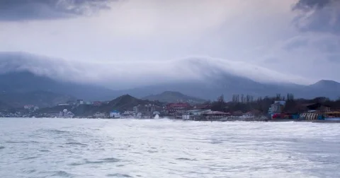 White clouds float over the sea and hills Stock Footage 75558479