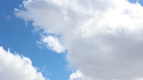 White clouds floating across the blue sky on sunny day Stock-Footage 180157941