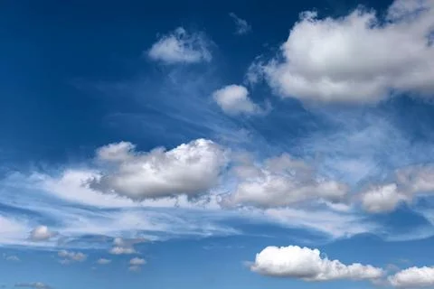 White Clouds Floating Across Blue Summer Sky Stock Photos