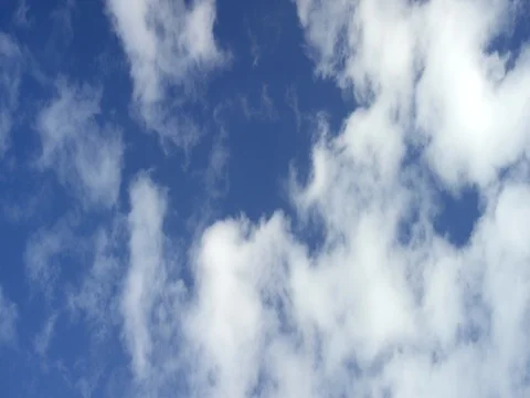 White clouds floating in blue sky Stock Footage