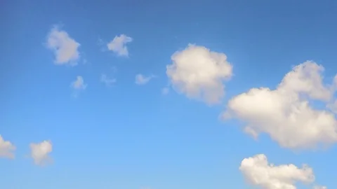 White clouds floating on a blue sky timelapse Stock Footage 81604213
