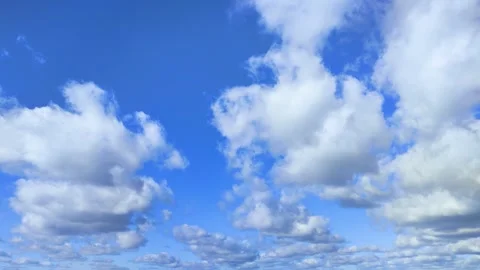 White clouds floating in the blue sky, panning Stock Footage 315920246