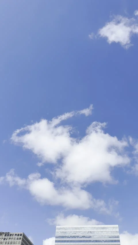 White Clouds Floating in Blue Sky Vertical Stock Footage 344991253