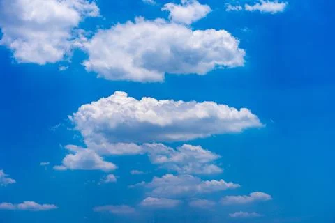 White clouds floating on the blue sky in beautiful weather Stock Photos