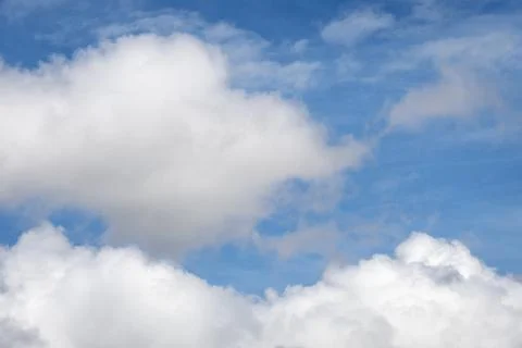 White Clouds Floating in Blue Sky with Copy Space Stock Photos