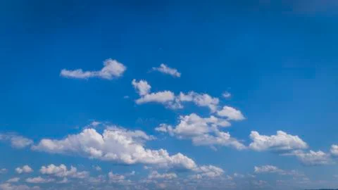 White Clouds Floating in the Bright Blue Skies Stock Photos