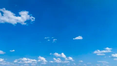 White Clouds Floating in the Bright Blue Skies Stock Photos