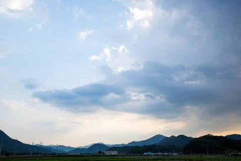 White Clouds Floating in Clear Blue Sky Landscape View Stockfoto's