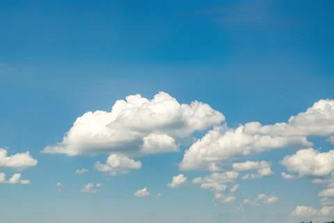 White Clouds Floating in Clear Blue Sky Stock Photos