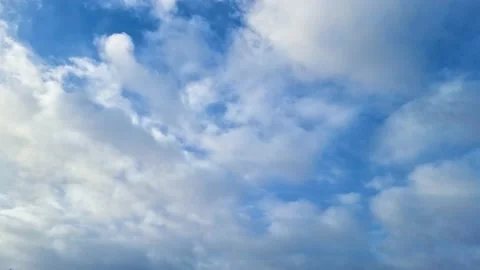 White clouds floating in the sky. blue sky white clouds. cumulus cloud clouds Stock Footage 229147454
