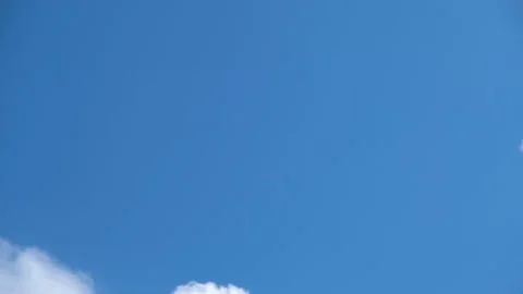 White clouds fly across the blue sky. Delicate clouds in the sky Stock Footage 196696450