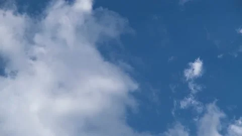 White clouds fly across the blue sky. Delicate clouds in the sky Stock Footage 201153954