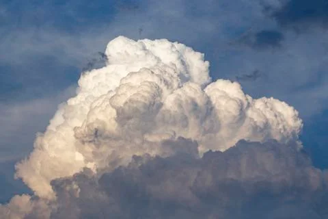 White clouds fly across the blue sky Stock Photos