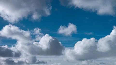 A white clouds fly in the blue sky Stock Photos