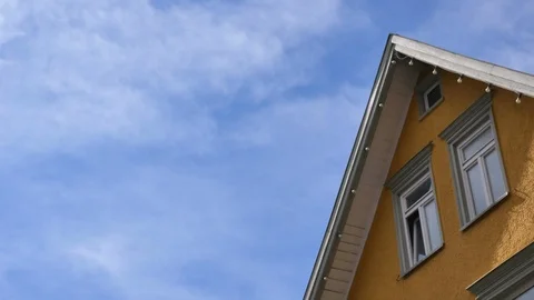 White clouds fly over the building, timelaps Stock Footage 88401128