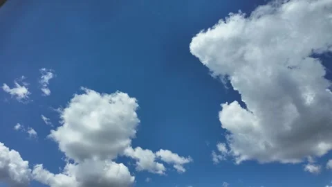White clouds flying across the blue sky. Beautiful summer background sky. Stock Footage 340410172