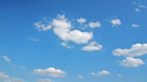 White clouds flying on blue sky - motion background time-lapse Stock Footage