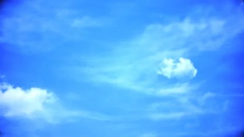 White clouds flying blue sky time lapse. Dark storm clouds are moving fast at Stock Illustration