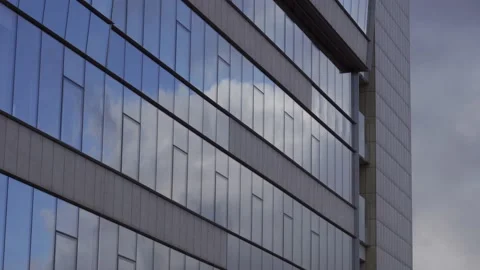 White clouds flying reflecting in business center building x4 speed up Stock Footage 218602010