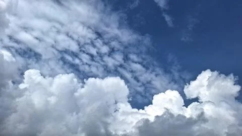 White Clouds Forming Beautiful Patterns in the Sky Stock Photos
