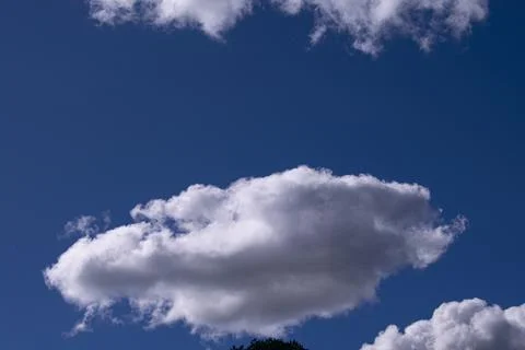 White clouds with forms in the blue sky Fotos de archivo