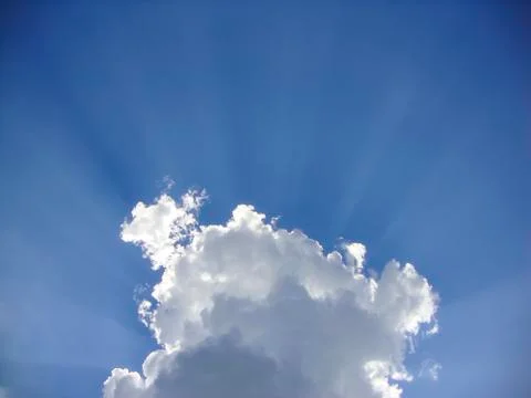 White clouds gently float on the blue sky in summer Stock Photos