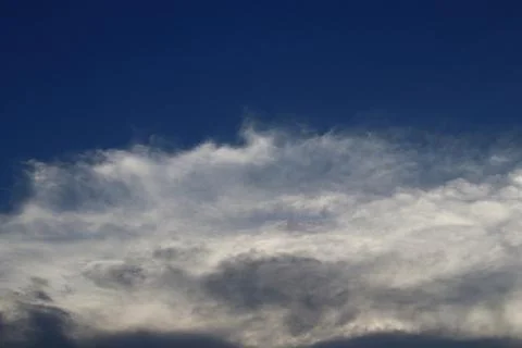 White clouds group at below and blue sky. Stock Photos