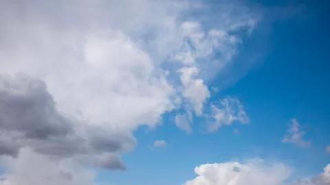 White clouds on a huge blue sky background Stock Photos