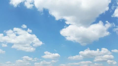 White clouds on light blue sky Stock Photos