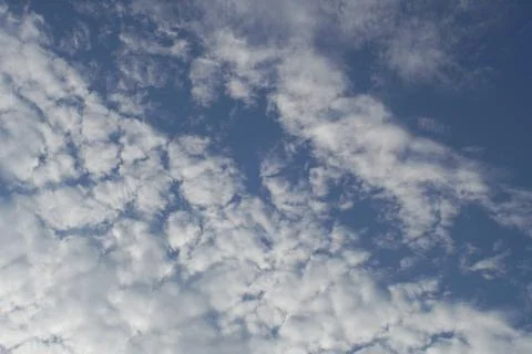 White clouds on a light blue sky Stock Photos