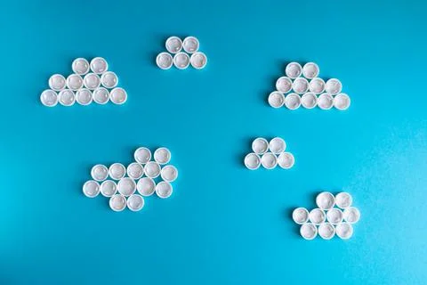 White clouds made of plastic bottle caps Stock Photos